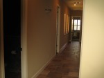 Looking down the hall from kitchen
Powder, then kids' bath. Playroom at end of hall. Kid's bedrooms on right.