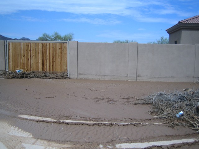 The driveway in front of the garage, with a water level mark.